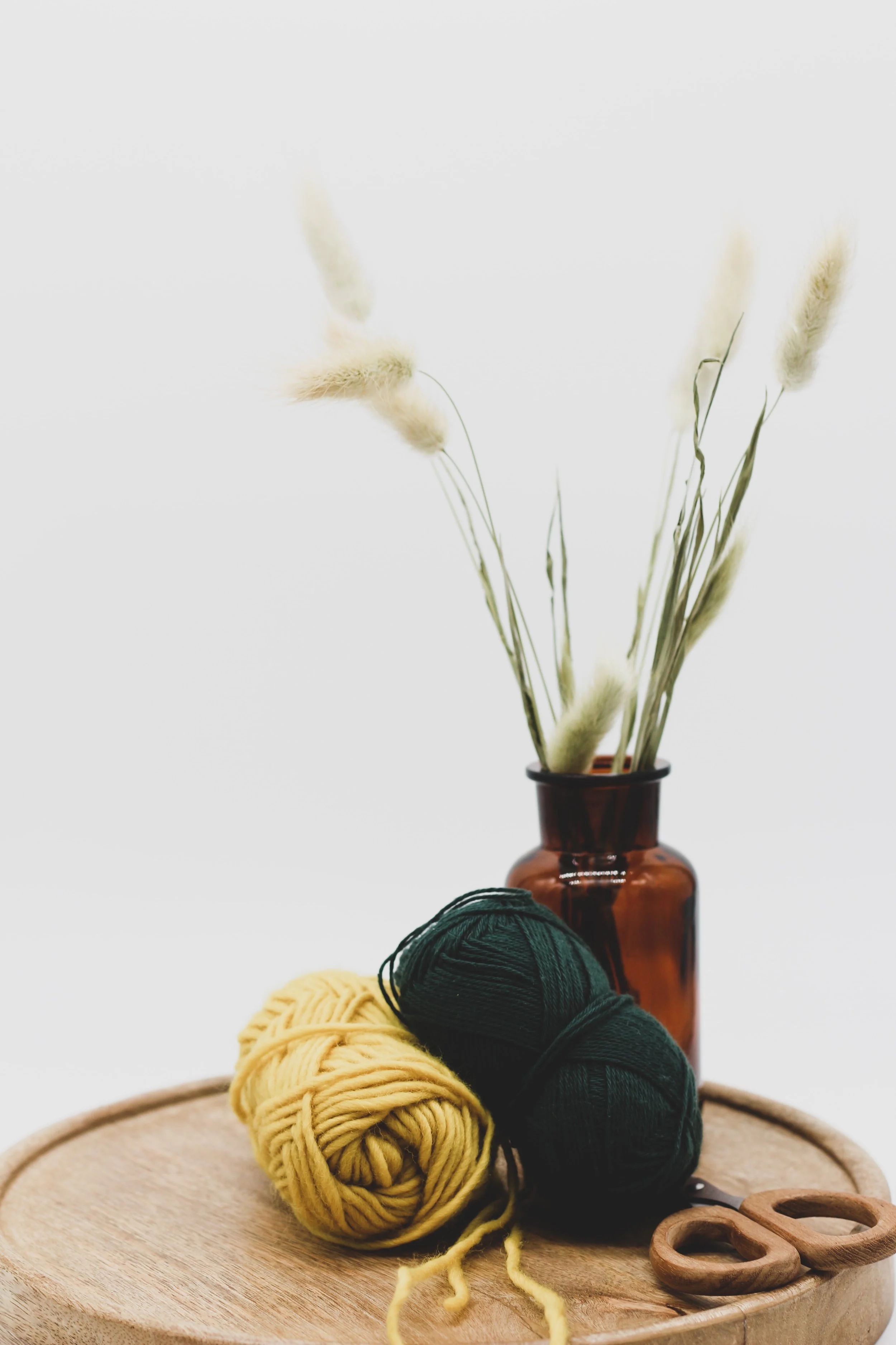 Cozy knitting basket with yarn and needles in a bright, coastal-inspired home