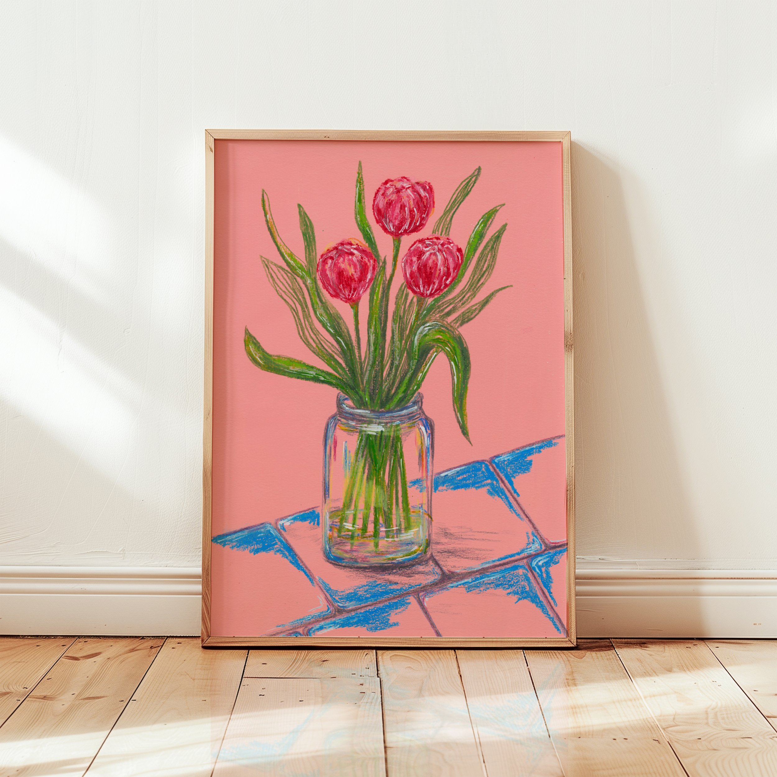 A wooden frame with a print of a drawing of pink tulips in a glass vase