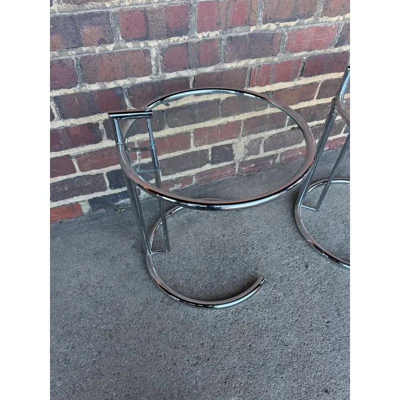 pair-of-adjustable-chrome-and-glass-tables-eileen-gray-style-6832.webp