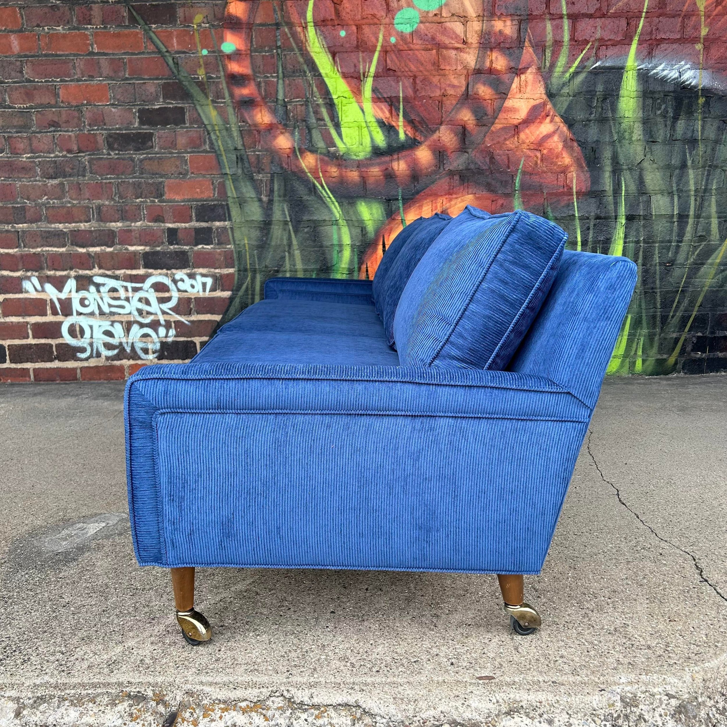 mid-century-modern-sofa-reupholstered-blue-corduroy-on-casters-possibly-selig-3576.jpeg