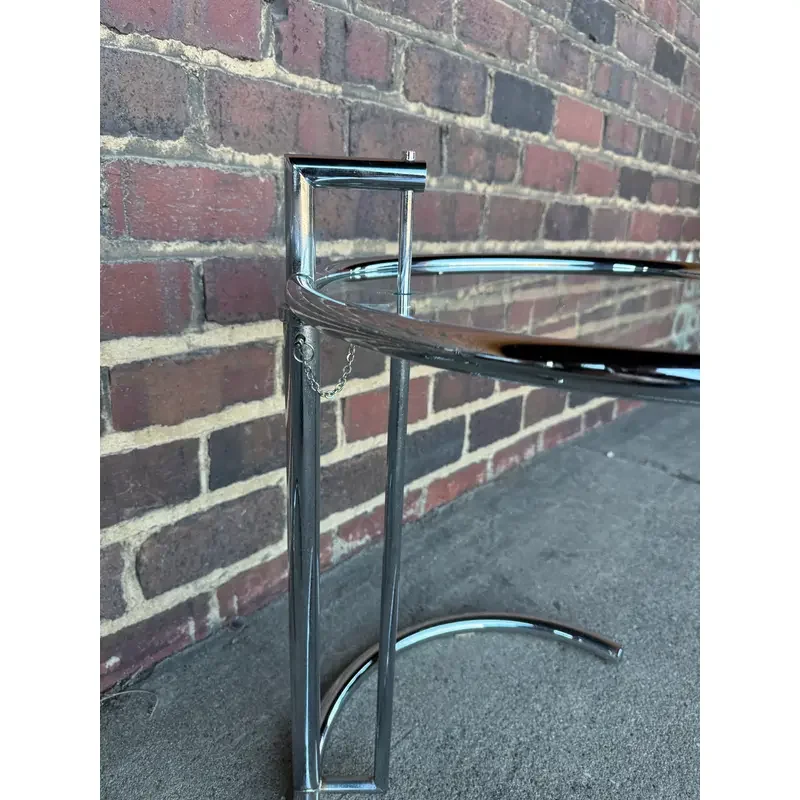pair-of-adjustable-chrome-and-glass-tables-eileen-gray-style-1845.webp