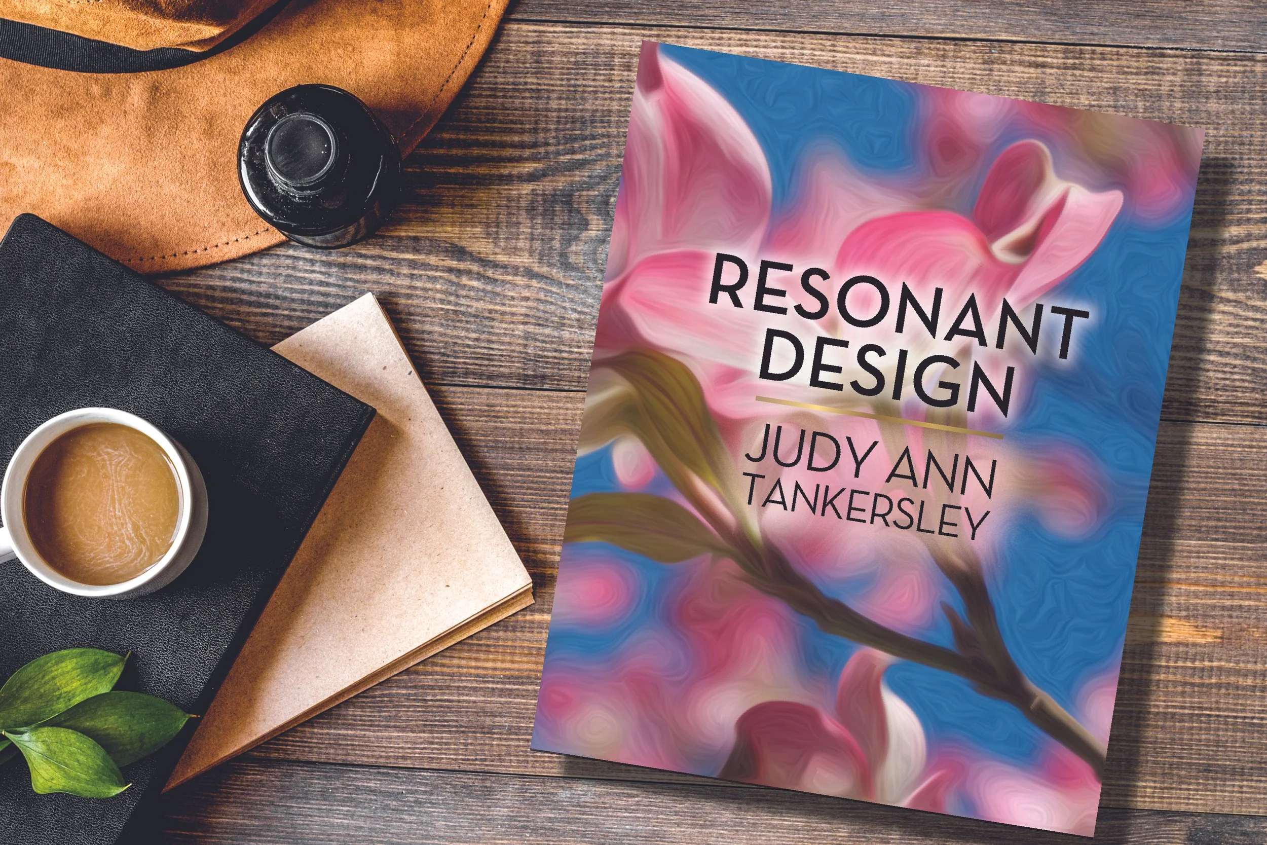 resonant art book lying on a table next to cup of coffee