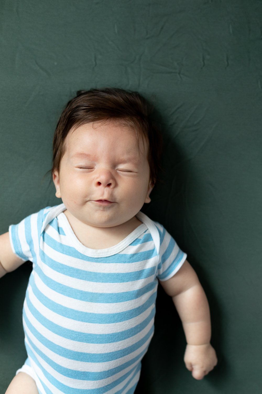 3 month old baby with sour facial expression