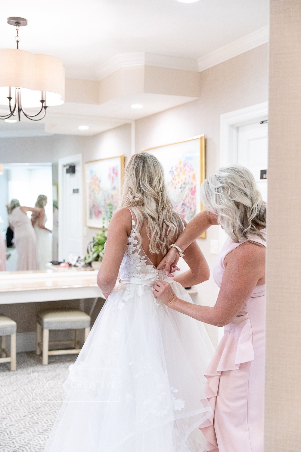 Mother Helping her daughter get ready on her wedding day