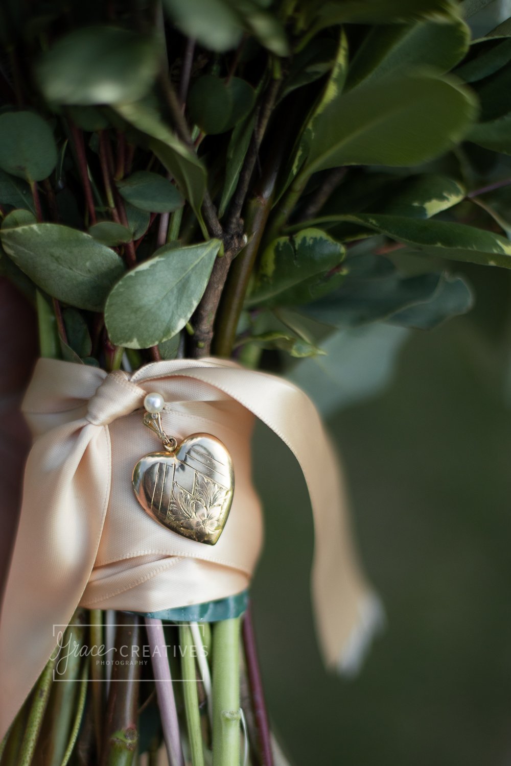 Locket wrapped around wedding flowers