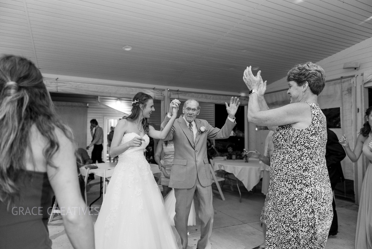 Bride dancing with grandpa at Sheboygan Yacht Club Summer Wedding