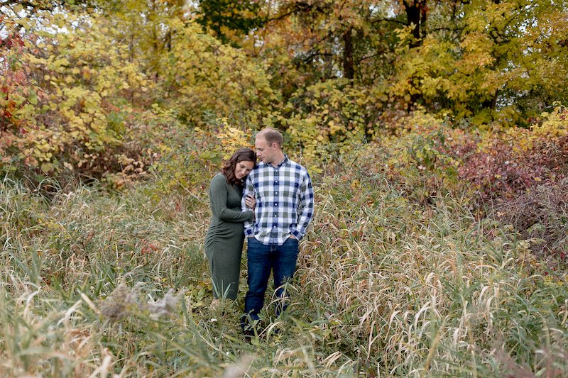 new mom and dad during a Fall Maternity Session at Fox Brook Park in Brookfield with Grace Creatives photography