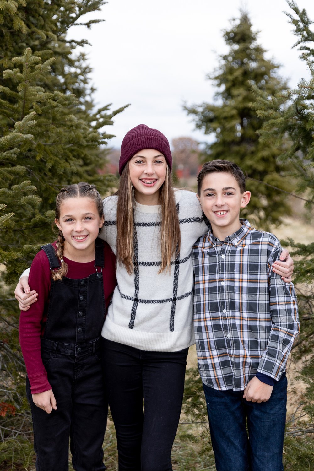 portrait of three older kids during Milwaukee Christmas mini session