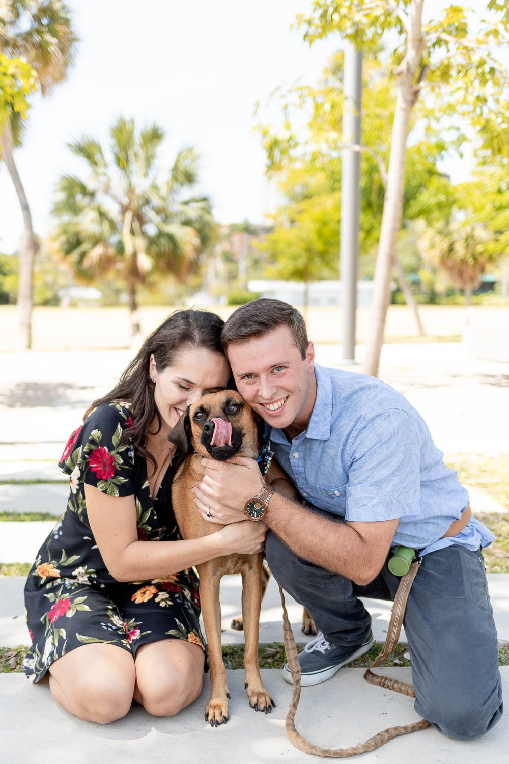 Couple with their adopted dog during engagement session with Grace Creatives