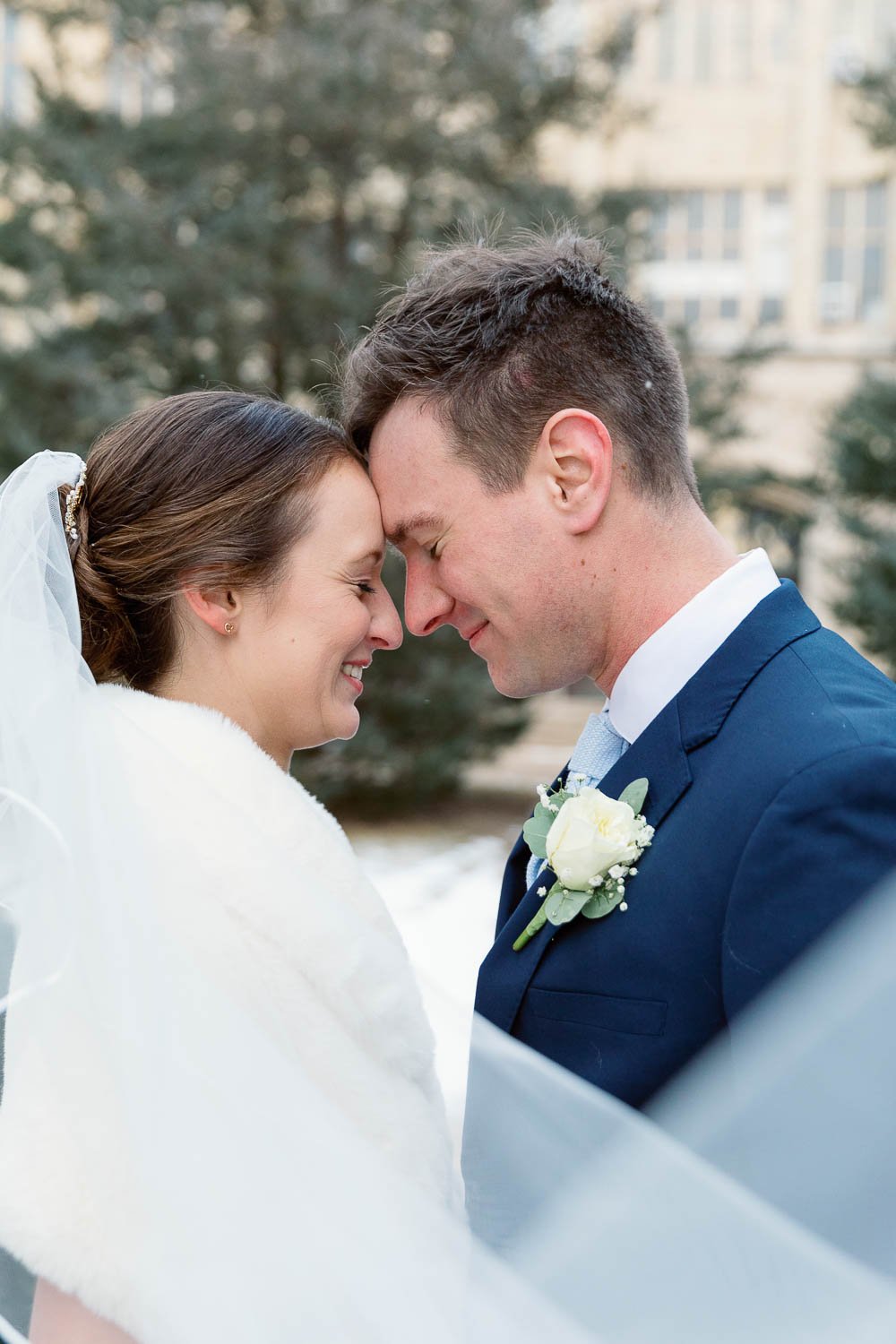 bride and groom touching foreheads couple portrait at Mount mary