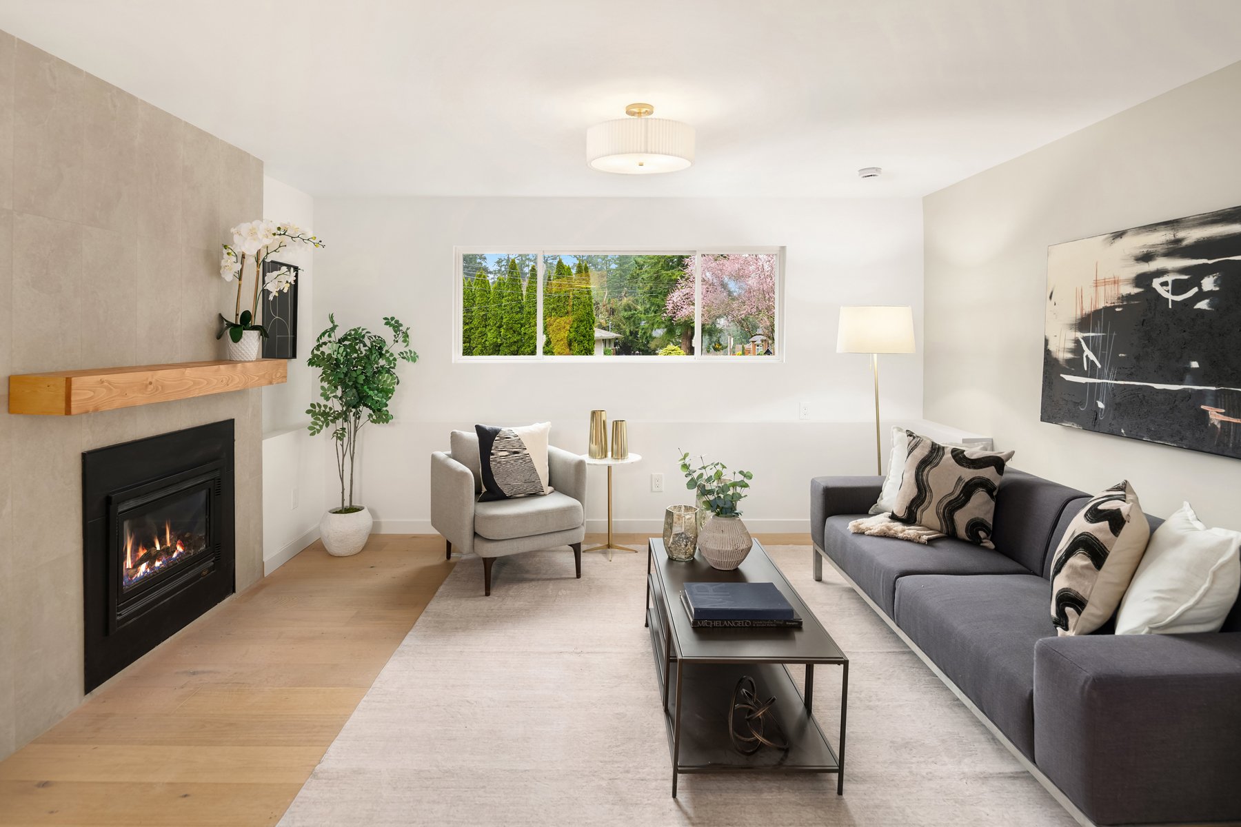 A modern living room representing a unit in a property managed by Ridge Realty