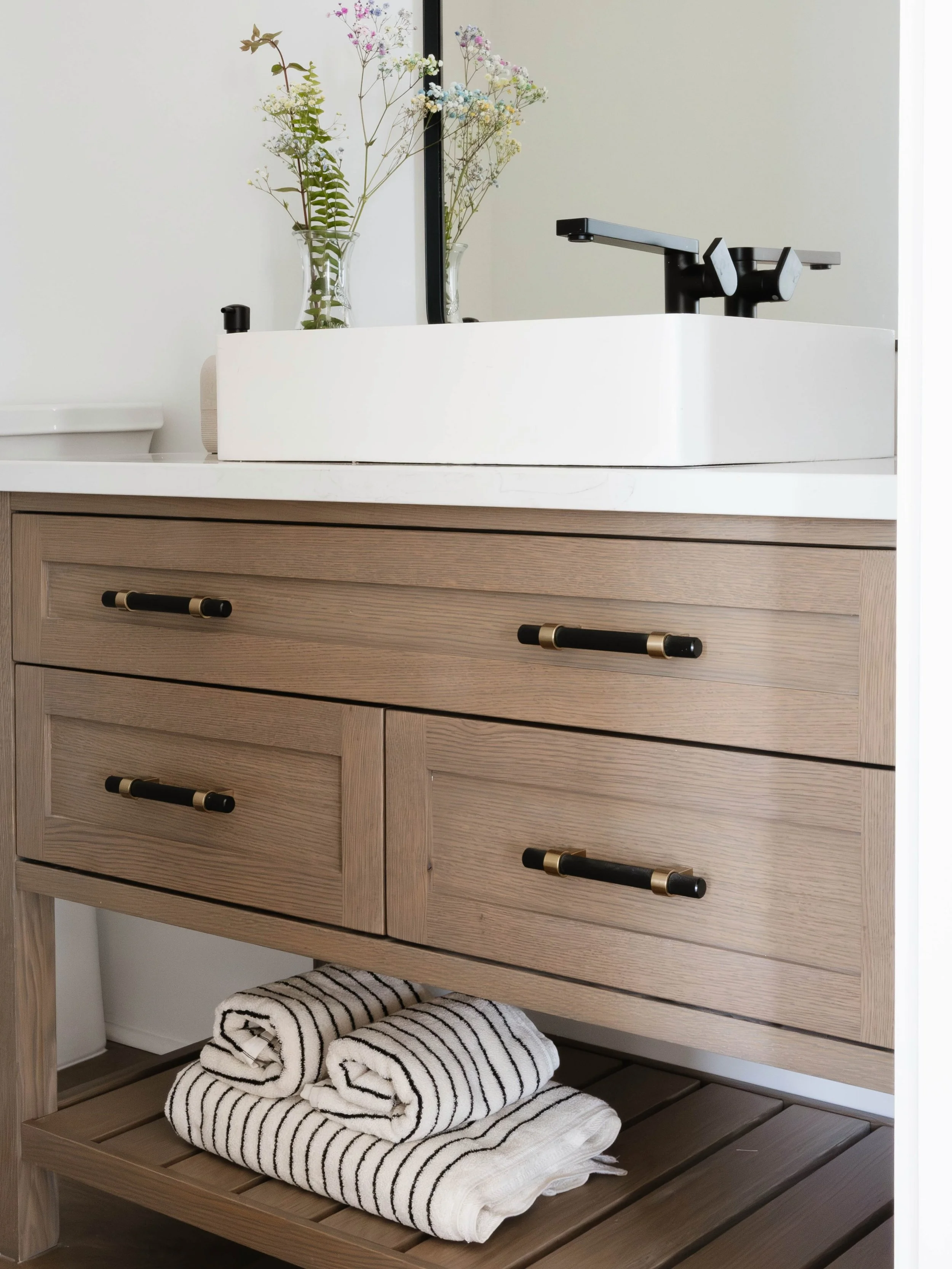 Cozy weekend getaway at home. This new construction modern lake home was designed to seamlessly blend clean, contemporary lines with warm tones. Featuring natural wood custom vanities, mixed metal accents, and panoramic views just outside the window.