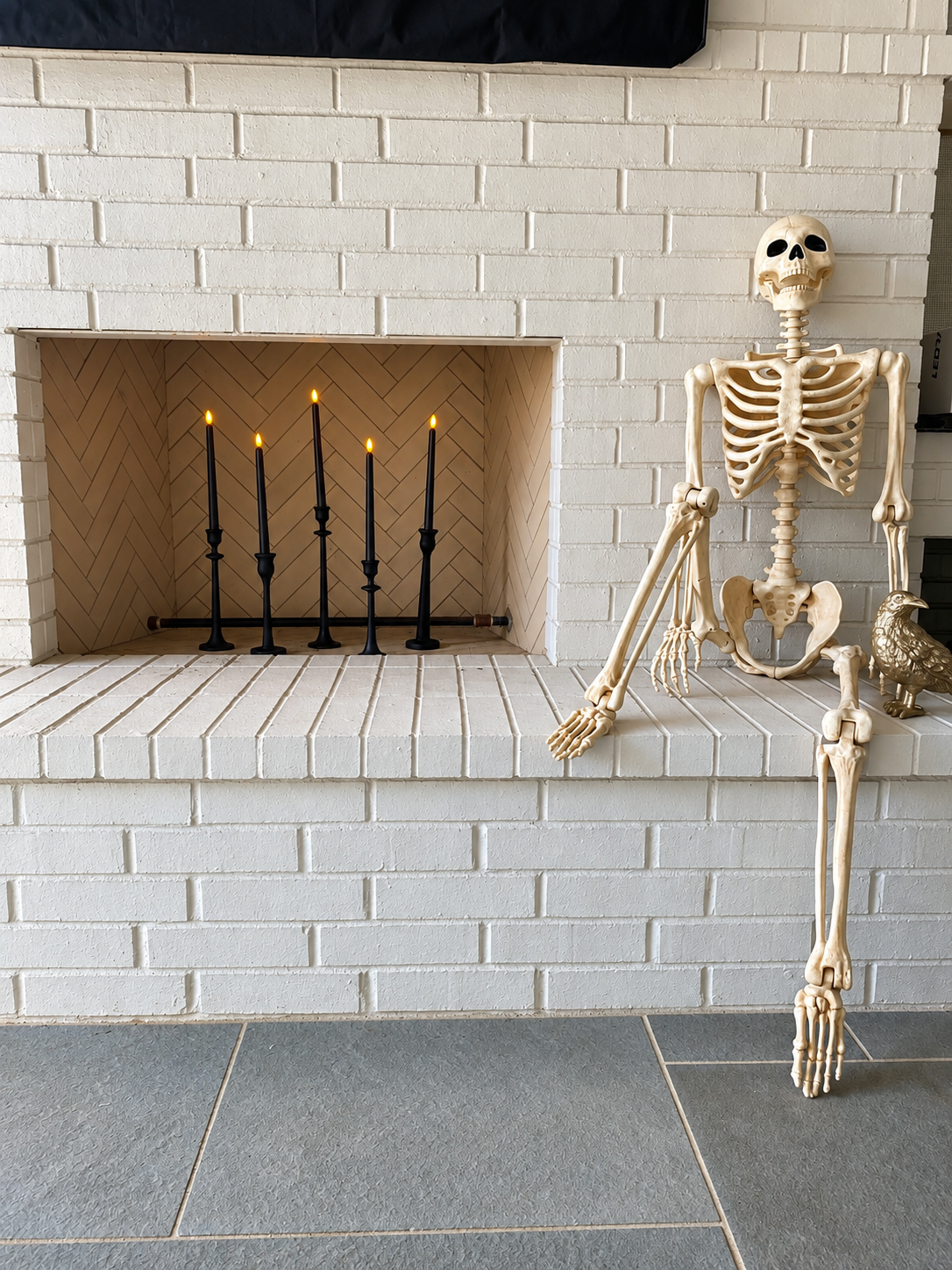 Candlelit Skeleton on a White Brick Hearth.png