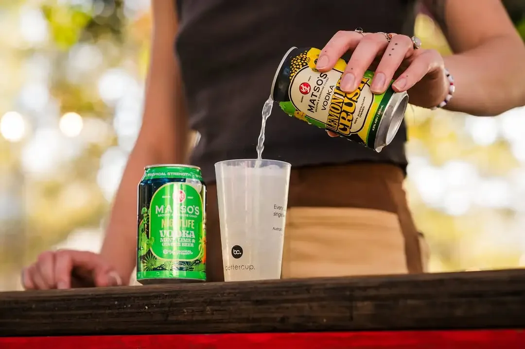 A drink being poured into a Bettercup branded reusable 285ml taster cup at Fringe World 2025