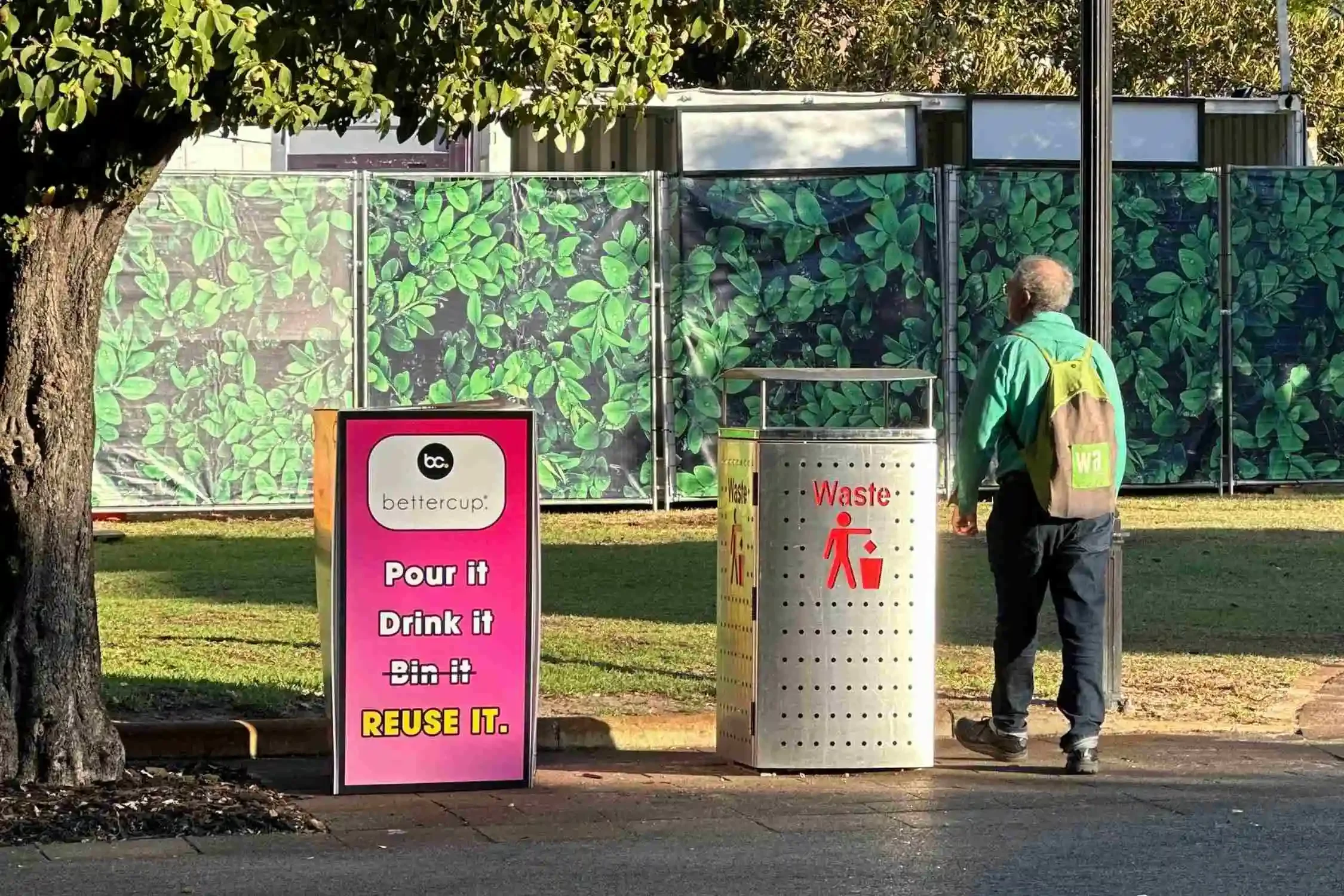 Bettercup sign reading “Pour it, Drink it, Reuse it” beside a waste bin at the Fringe World 2025.