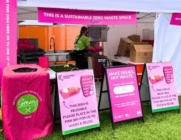 Pink bins and branded signage at the washing station at the Moomba Festival 2026.