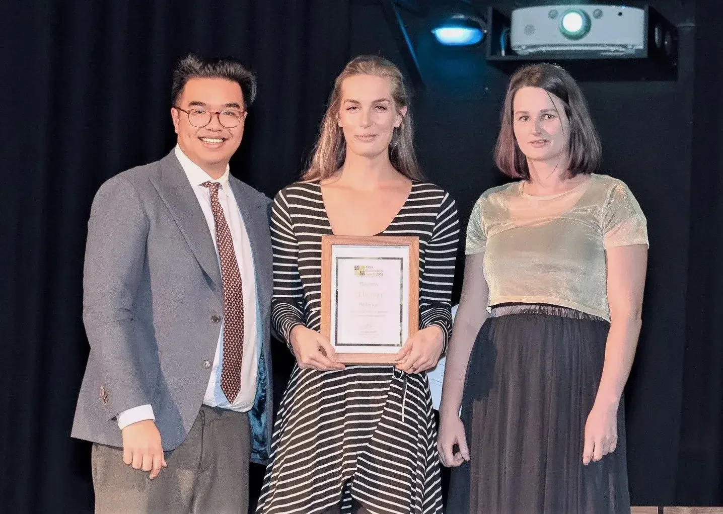 Bettercup co-founders, Christie Kamphuis and Sam Stone, received the Yarra Sustainability Awards on stage with presenter.