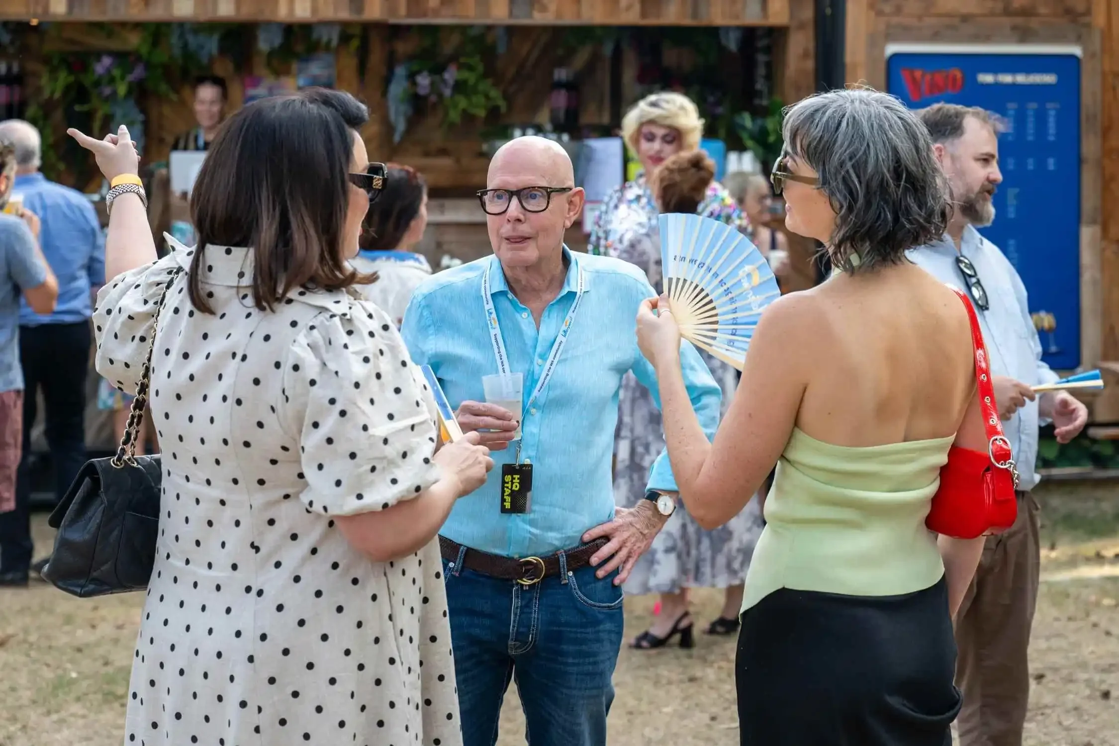 People socialising and drinking from bettercup reusable cups at Fringe World event.