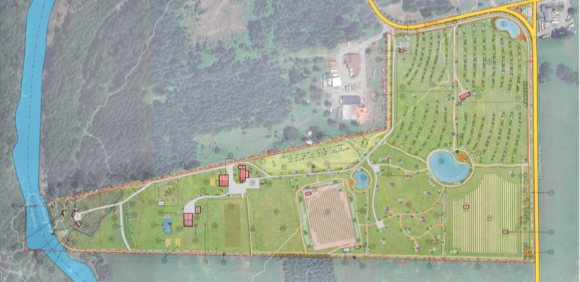 A detailed map of a large landscaped park or estate featuring lakes, pathways, gardens, and buildings, with surrounding roads and a river on the left side.