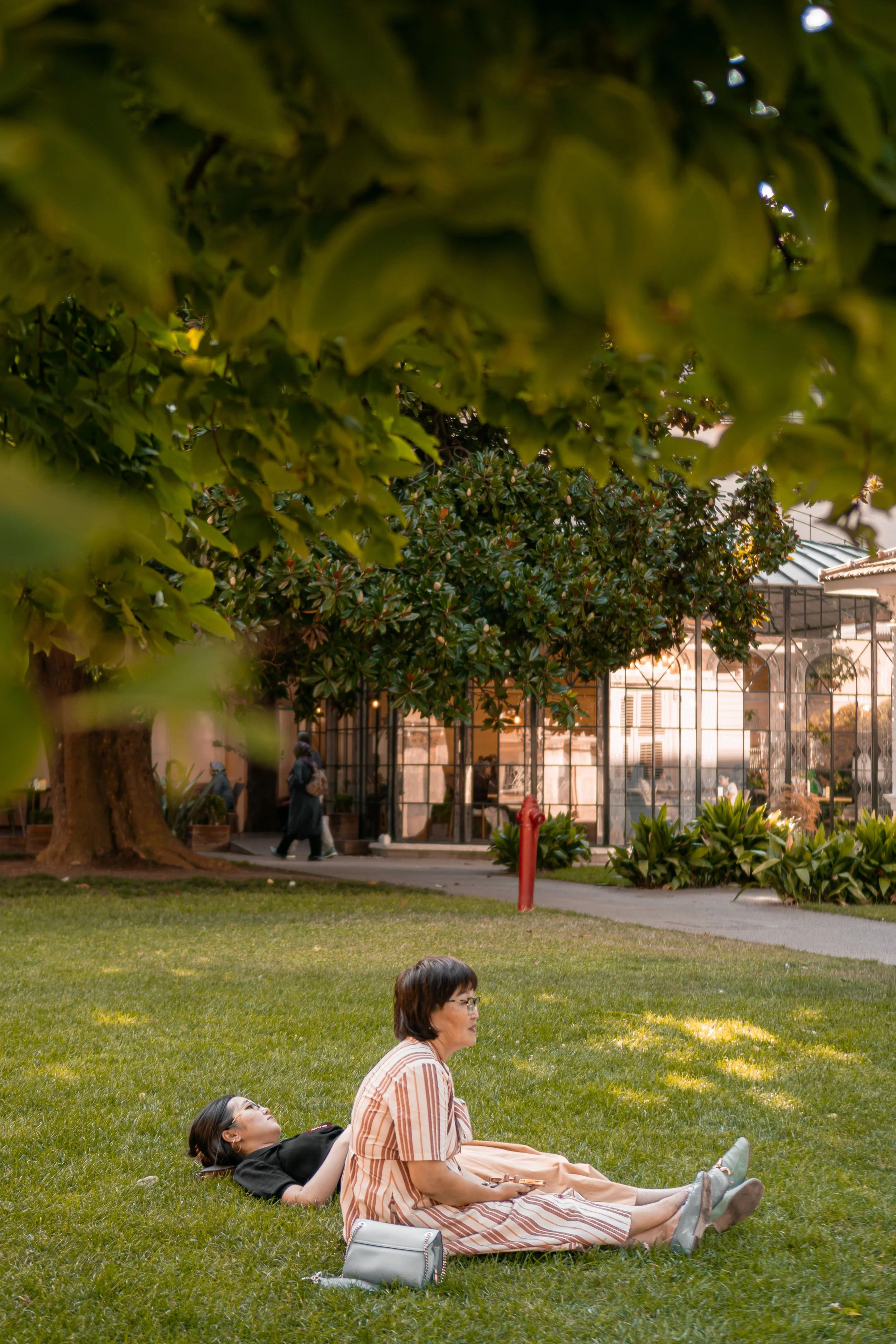 bipoc millennial woman lying in dolores park san francisco no longer consumed with anxiety
