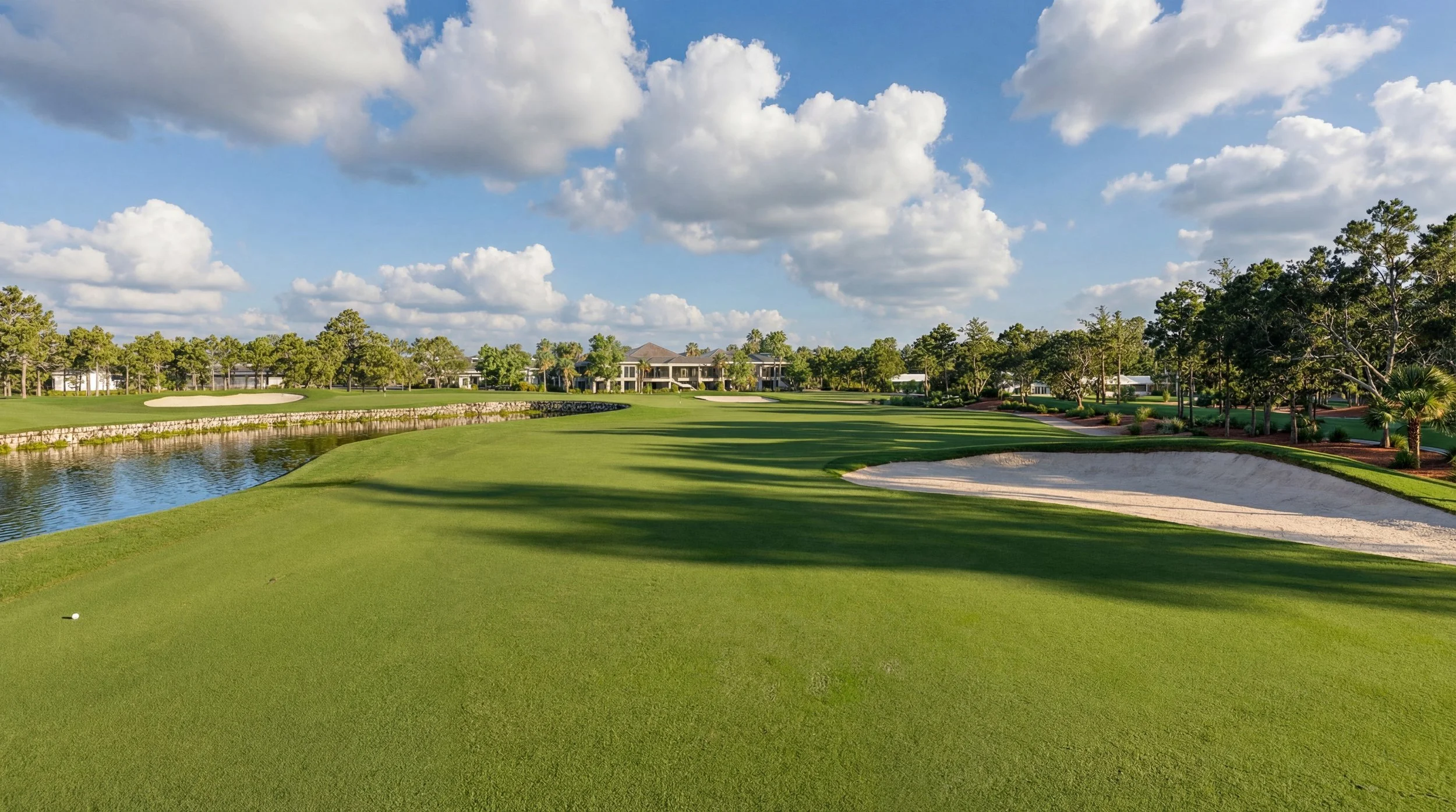 Individual-hole aerial showing tees, fairway, bunkers, hazards, vegetation, and green complex