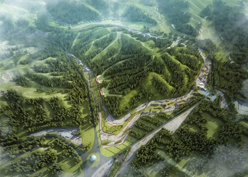 Aerial view of a green, hilly landscape with terraced hills, winding roads, and forested areas.