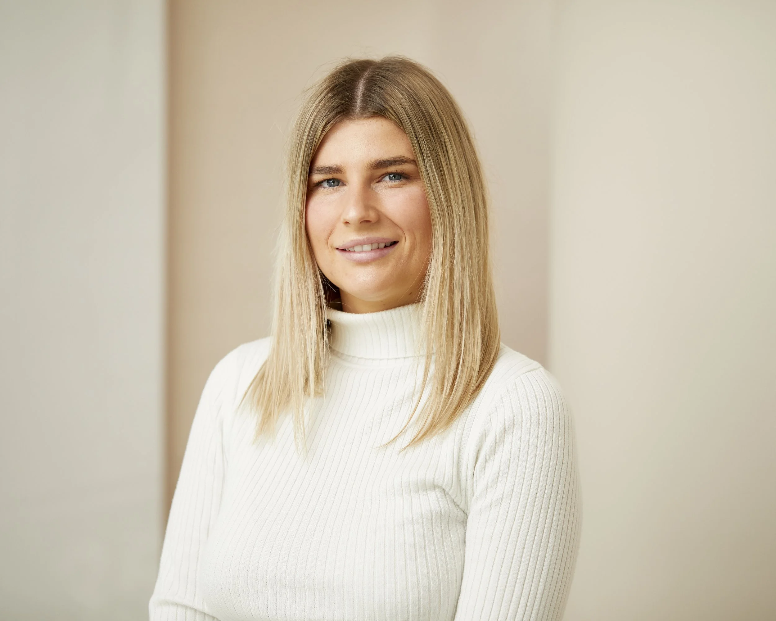 Professional headshot Melbourne allied health woman in white