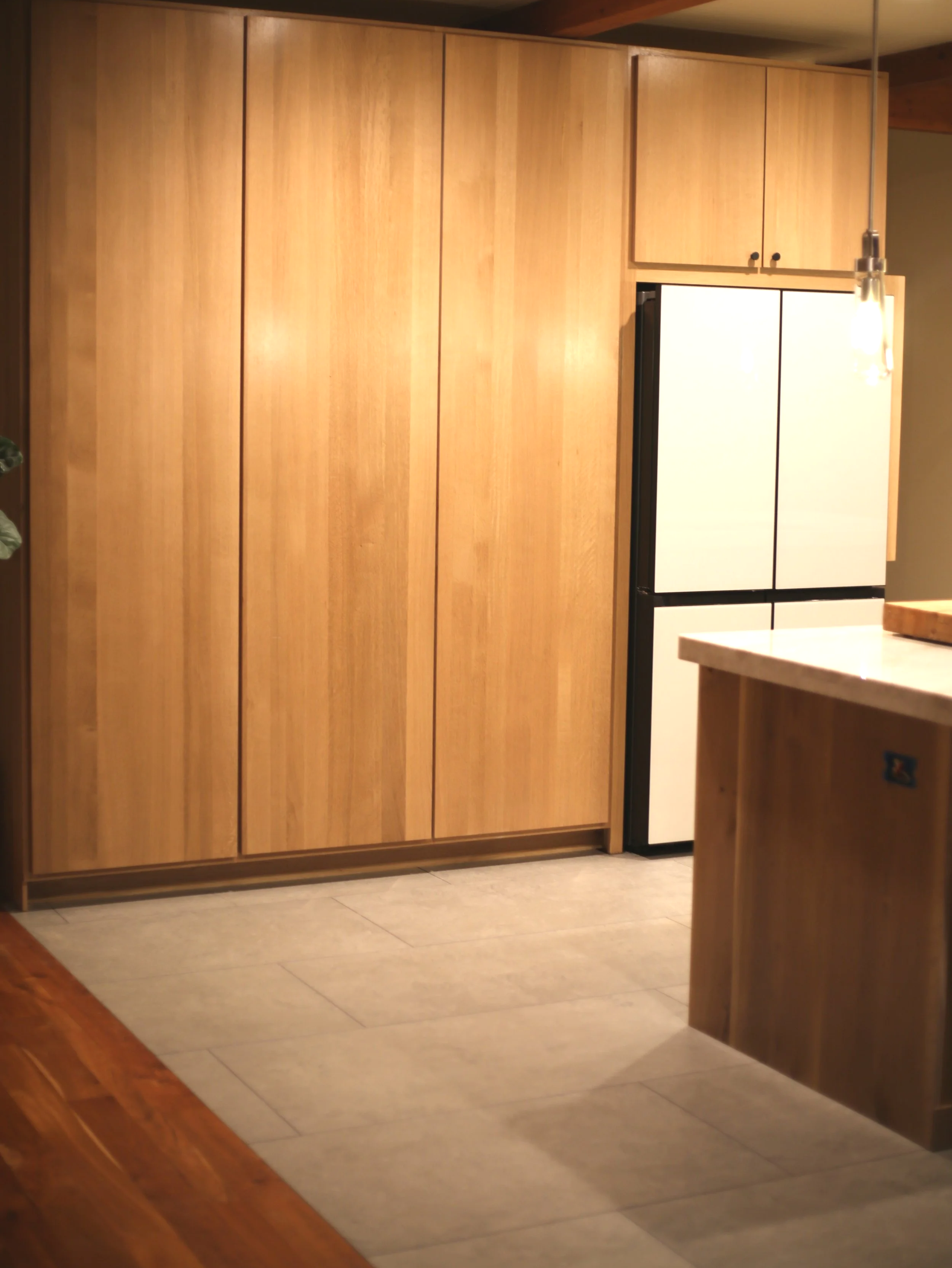 Rift sawn white oak slab cabinetry ten foot doors