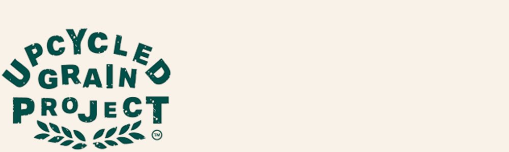 Upcycled Grain Project logo with text and decorative leaves.