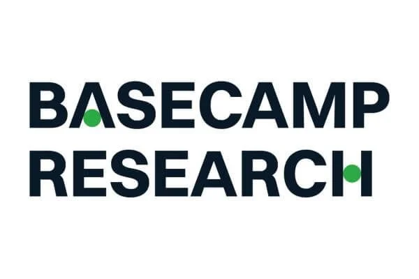 The logo for Basecamp Research with the words "Basecamp Research" in bold black letters and green geometric accents in the 'A' of 'Basecamp' and the 'H' of 'Research'.