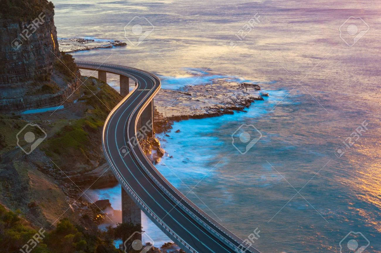 79344463-aerial-view-of-bridge-along-cliff-edge-and-ocean-sea-cliff-bridge-view-on-sunrise-illawarra-new-sout.jpg