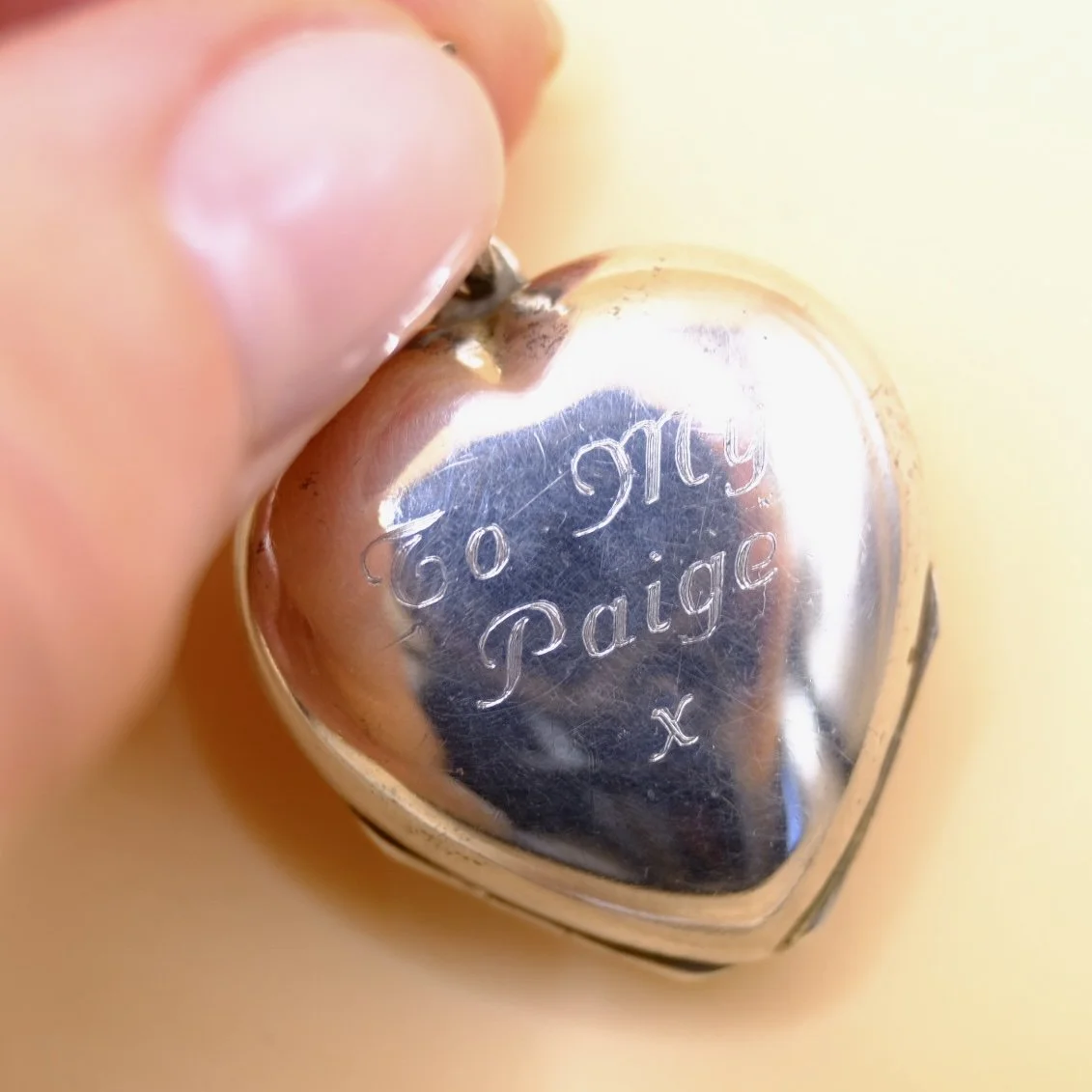 BVL919-silver-double-heart-locket-held.jpg