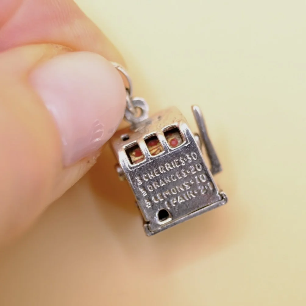 BVL1133-silver-fruit-machine-pendant-held.jpg