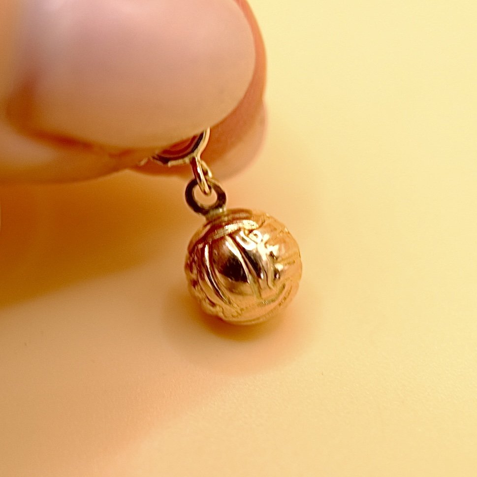 BVL1028-9ct-football-charm-held.jpg