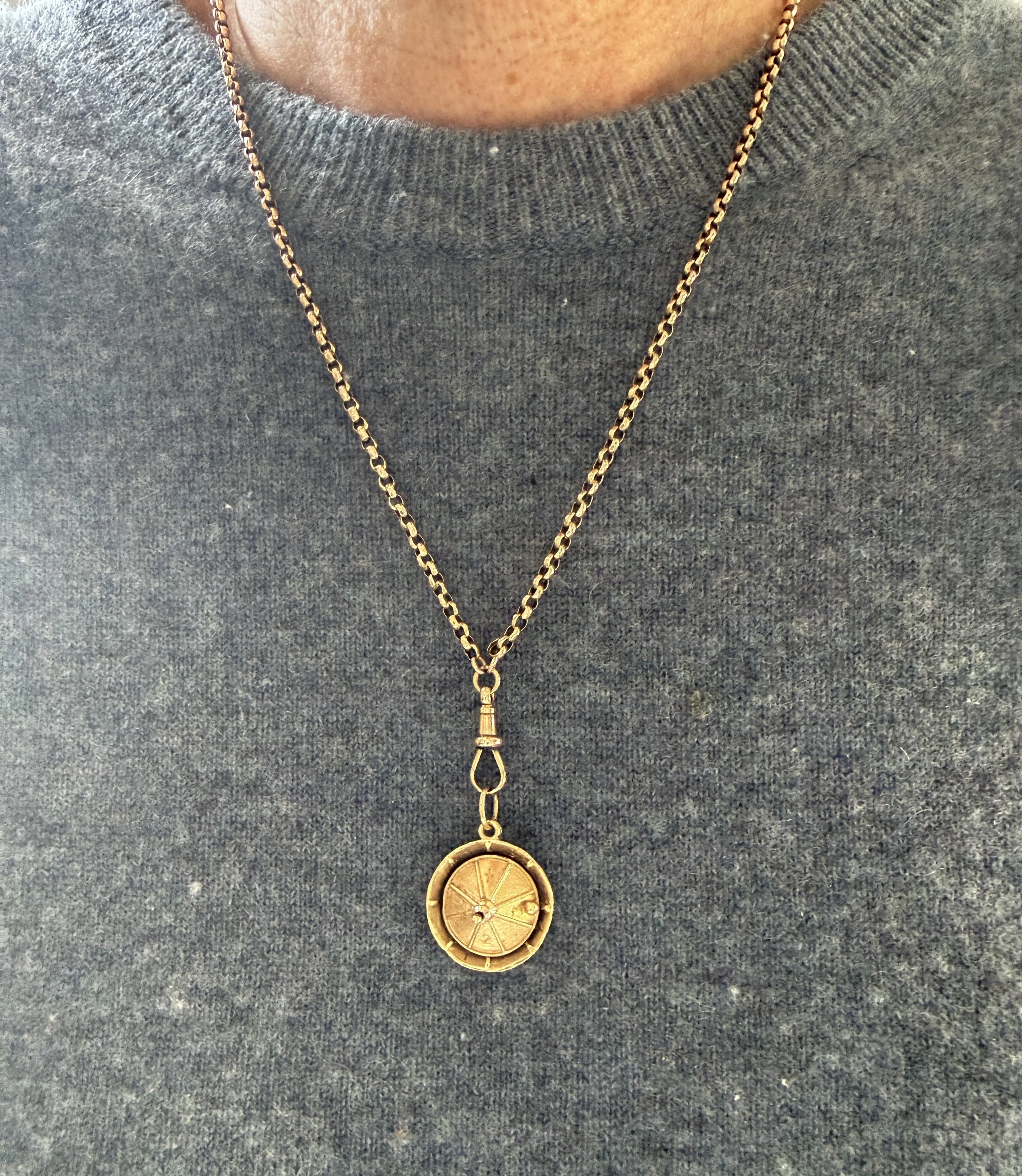 BVL1127-gold-roulette-wheel-pendant-worn.jpg