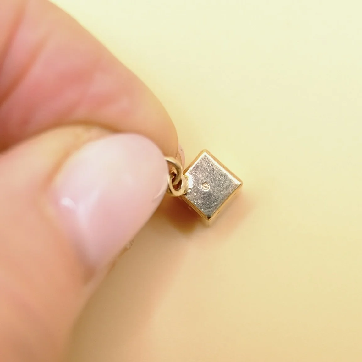 BVL1056-9ct-dice-charm-held.jpg