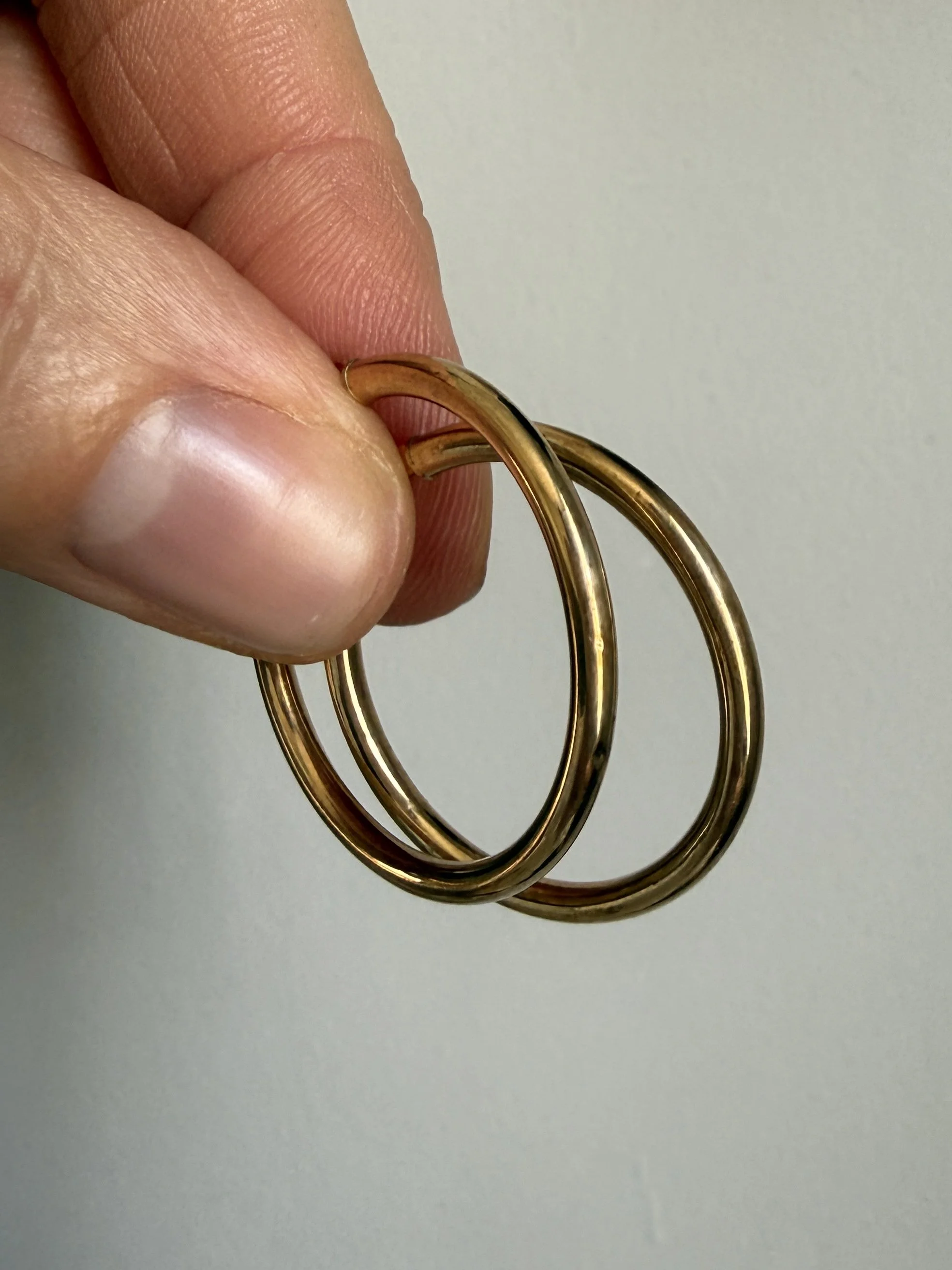 BVL1189-9ct-gold-medium-hoops-held.jpg