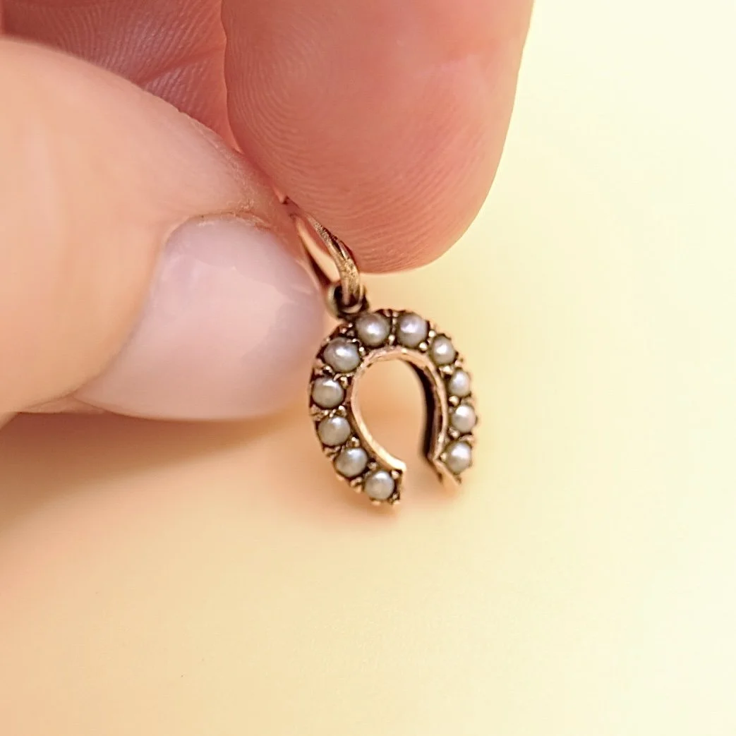 BVL1011-pearl-horseshoe-pendant-held.jpg
