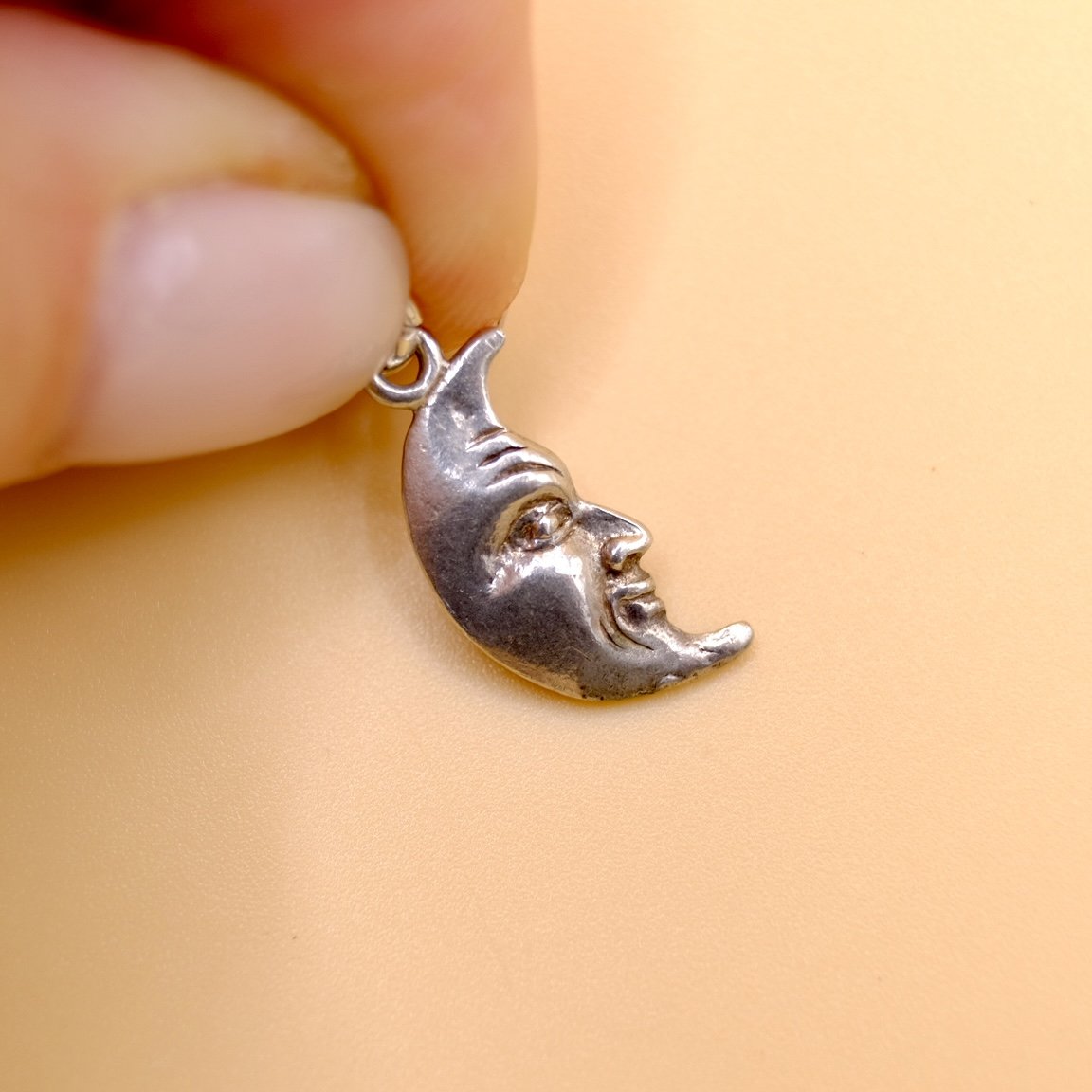 BVL874 silver-moonface-pendant held.jpg
