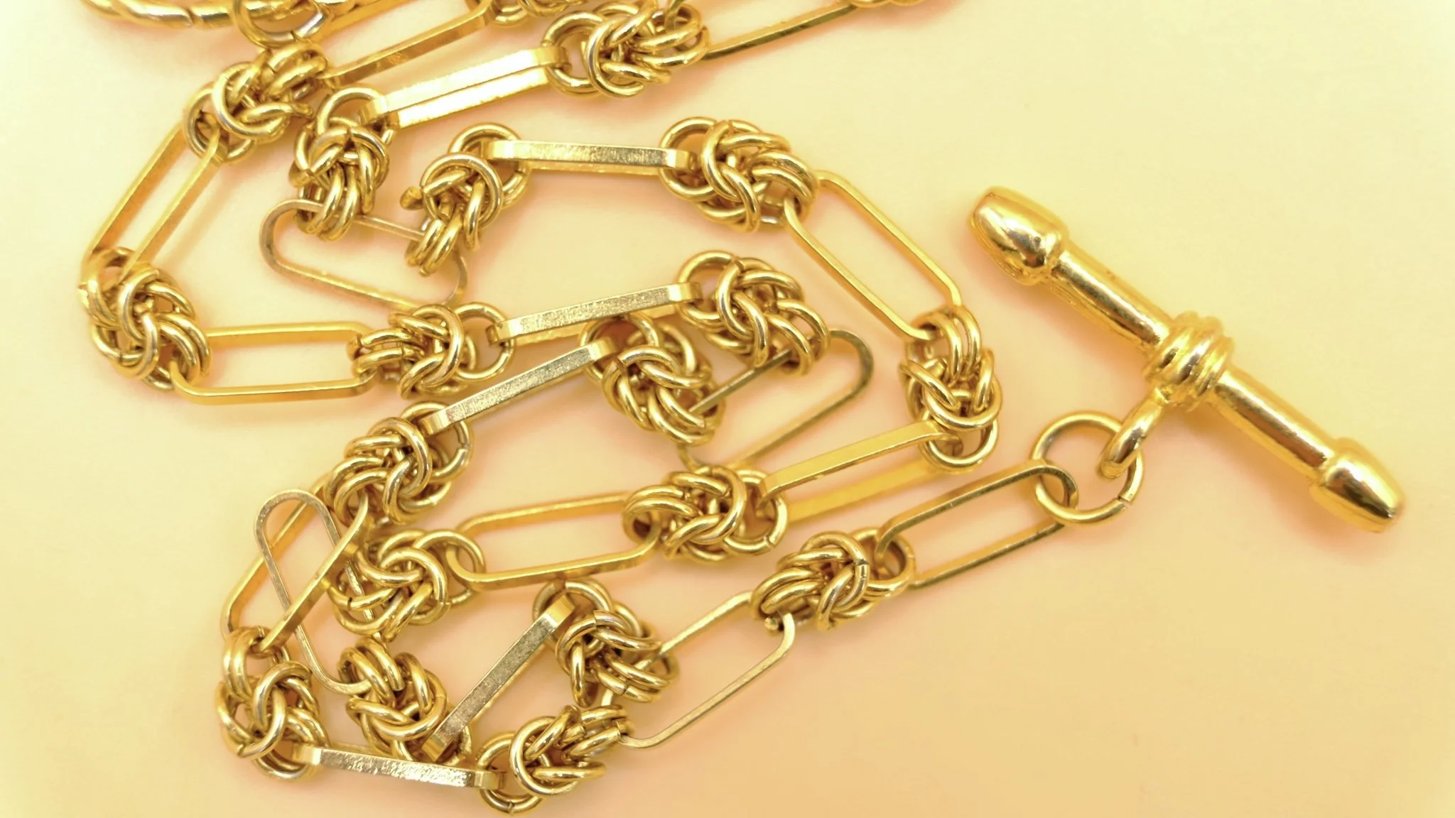 Gold plated trombone and knot link Albert chain