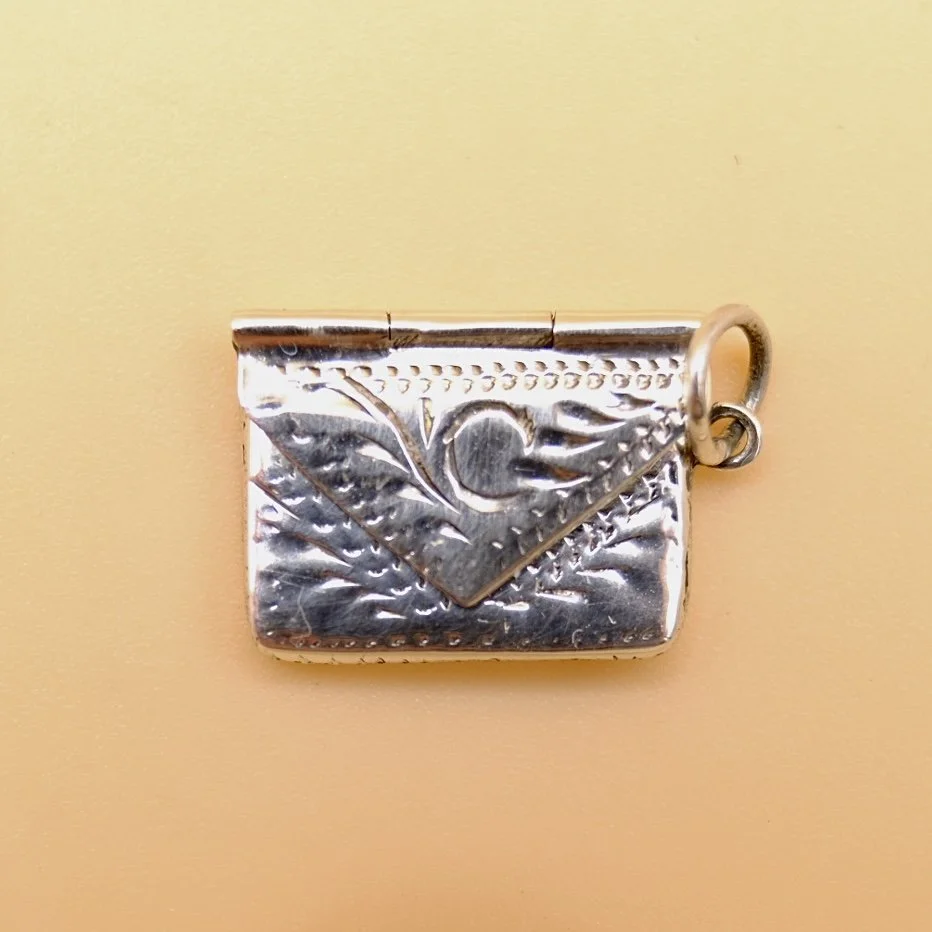 Small silver engraved envelope pendant