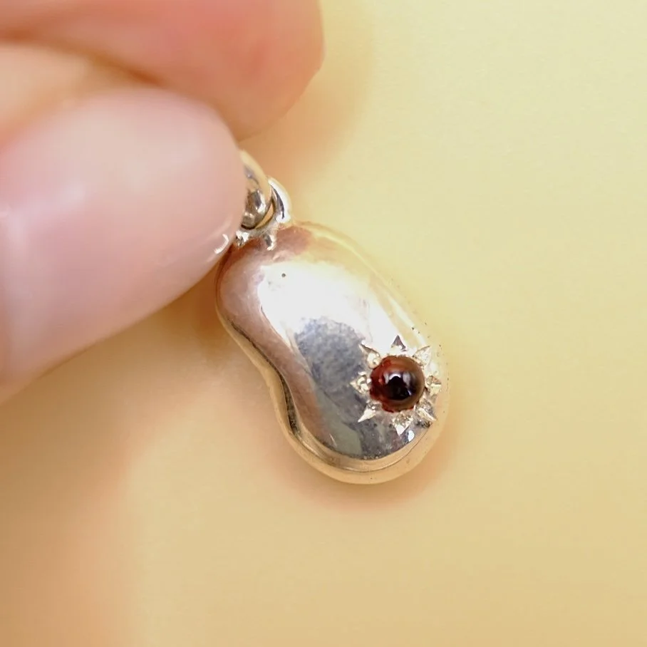 BVL1153-silver-red-bean-pendant-held.jpg