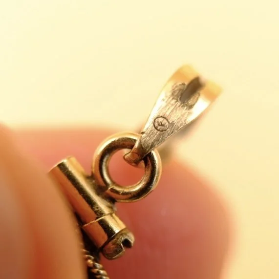 BVL1121-gold-nuggets-locket-marks.jpg