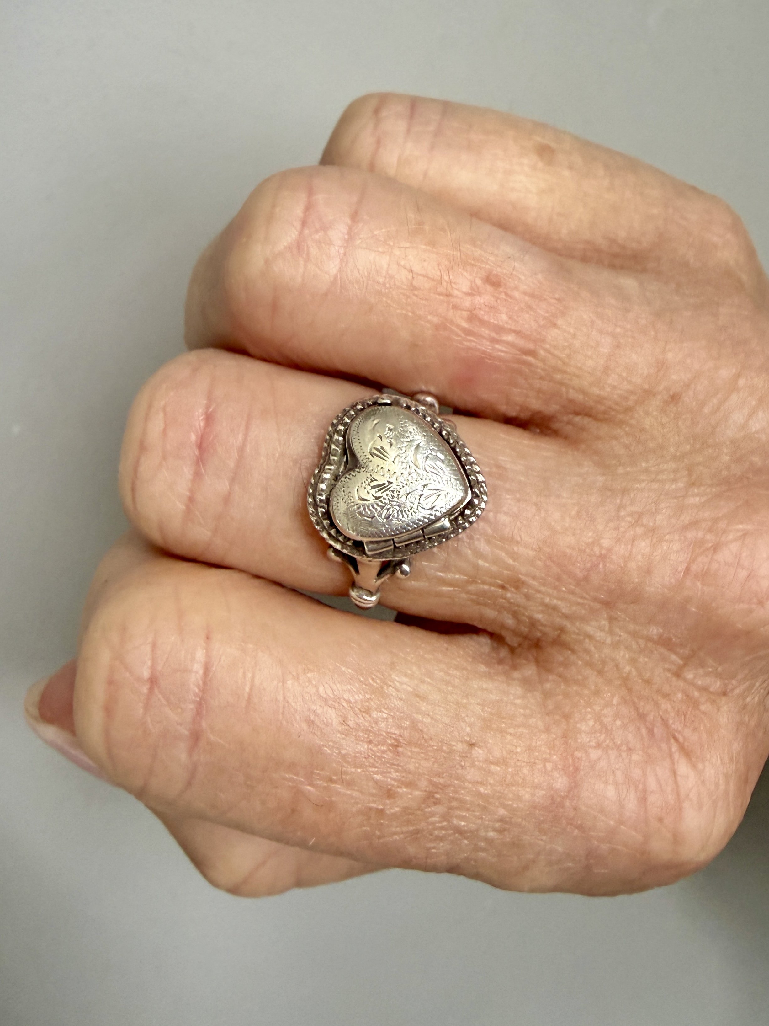 BVL1242-silver-heart- locket-ring-worn.jpg
