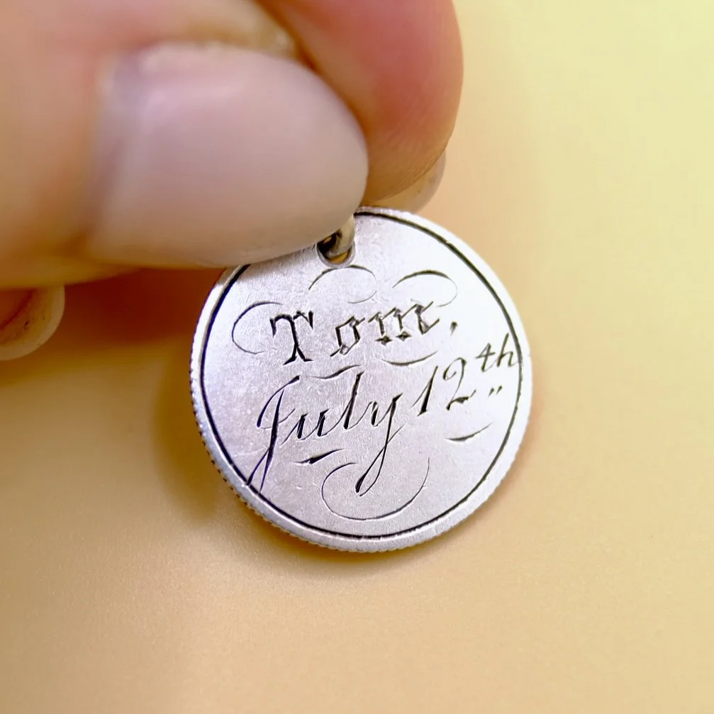 BVL1026-silver-Tom-coin-held.jpg