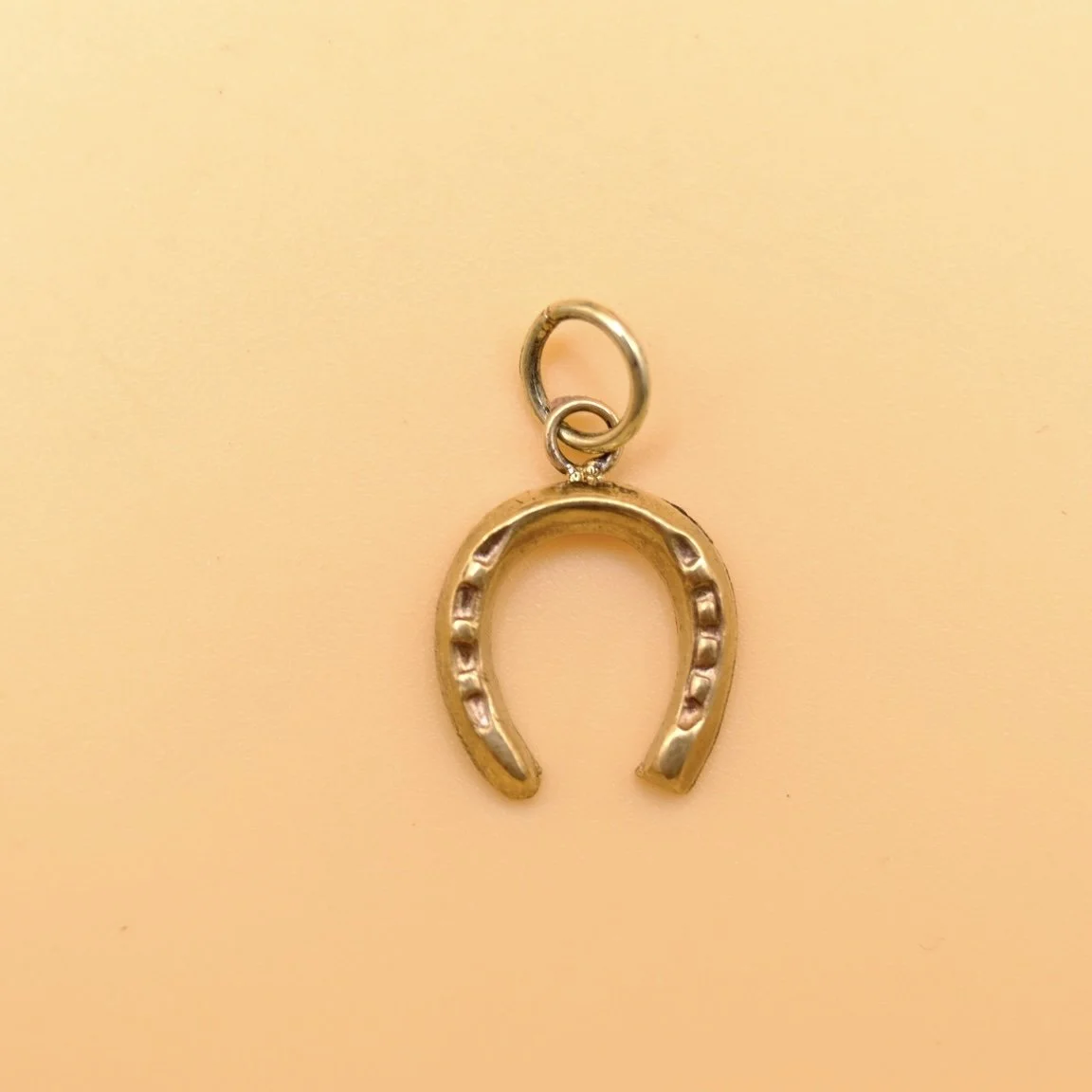 Gold plated horseshoe pendant