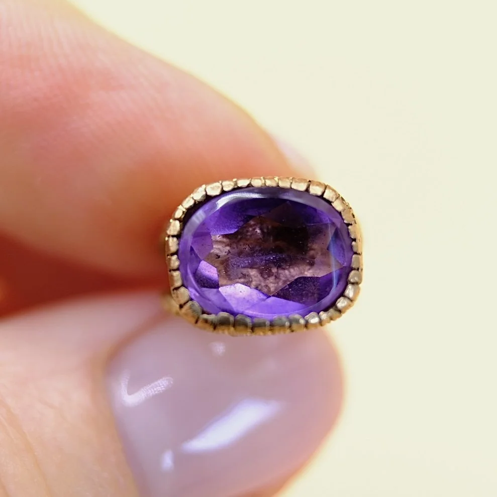BVL1082-purple-oval-seal-pendant-held.jpg