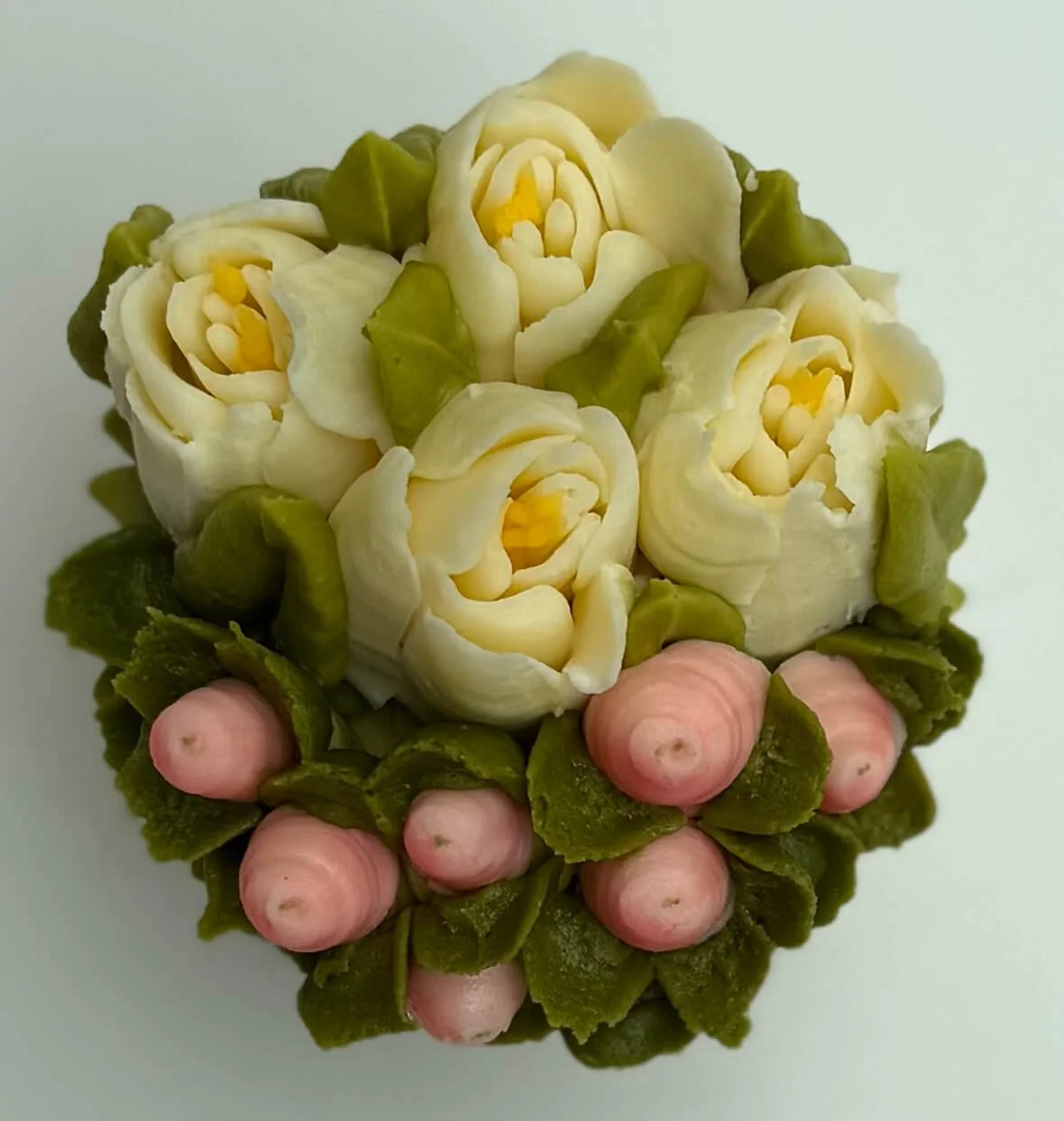 White tulips with pink hypericum berries