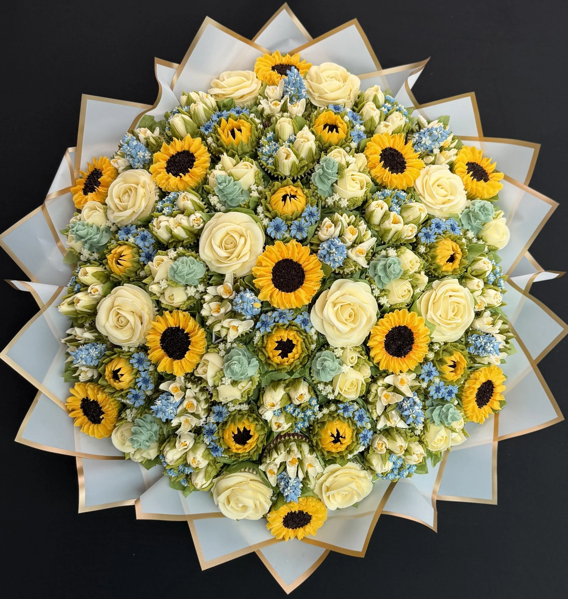 61 cupcake dome bouquet of 6 different blooms (65 x 65cm)
Sunflowers and Delphiniums