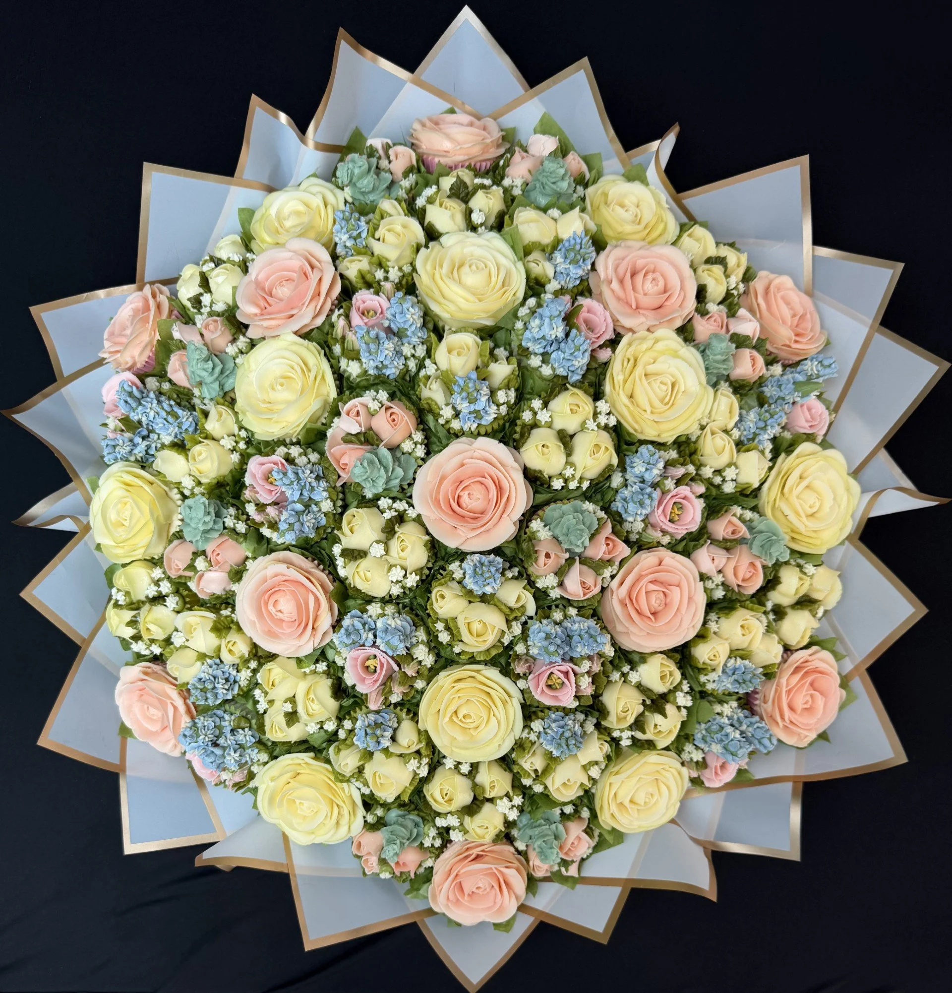 61 cupcake dome bouquet of 6 different blooms (65 x 65cm)
Pastel Shades